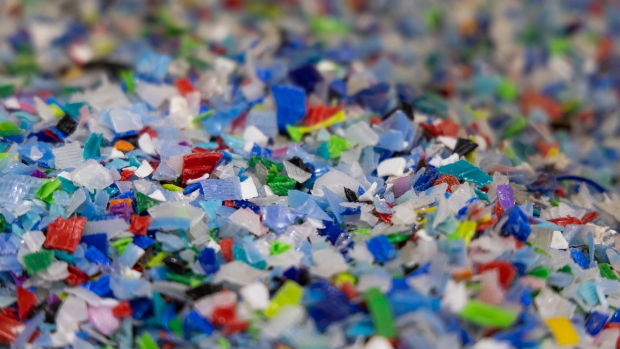Multi-colored plastic flakes at a recycling center