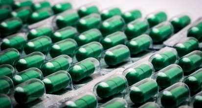 Close-Up Of Green Capsules In Blister Packs